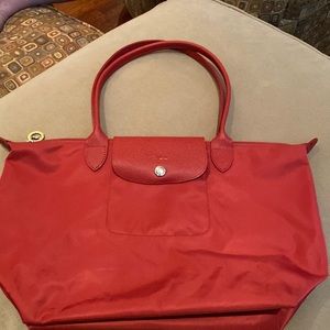 Longchamp Nylon Cranberry Red Shoulder Bag with Cranberry Red Leather Straps.